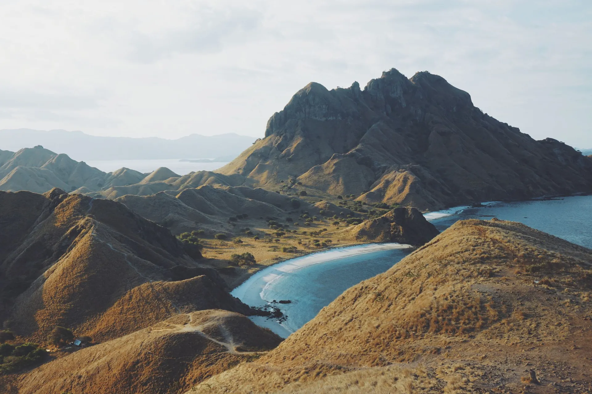 Aerial view of the ridged hills and curved beaches of Padar Island, Komodo National Park