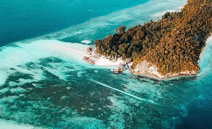 Aerial view of Cape Kri, Kri island and the reef edge in the Dampier Strait, Raja Ampat