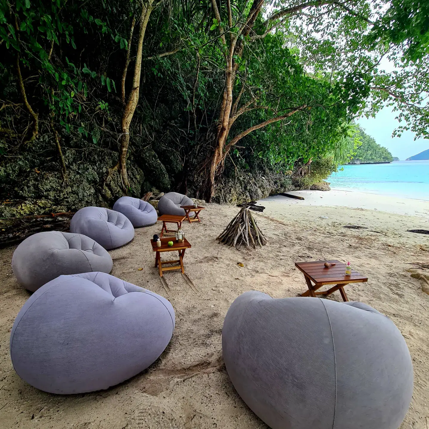 Private beach dinner at sunset James & Caroline W. yacht charter experience — Komodo