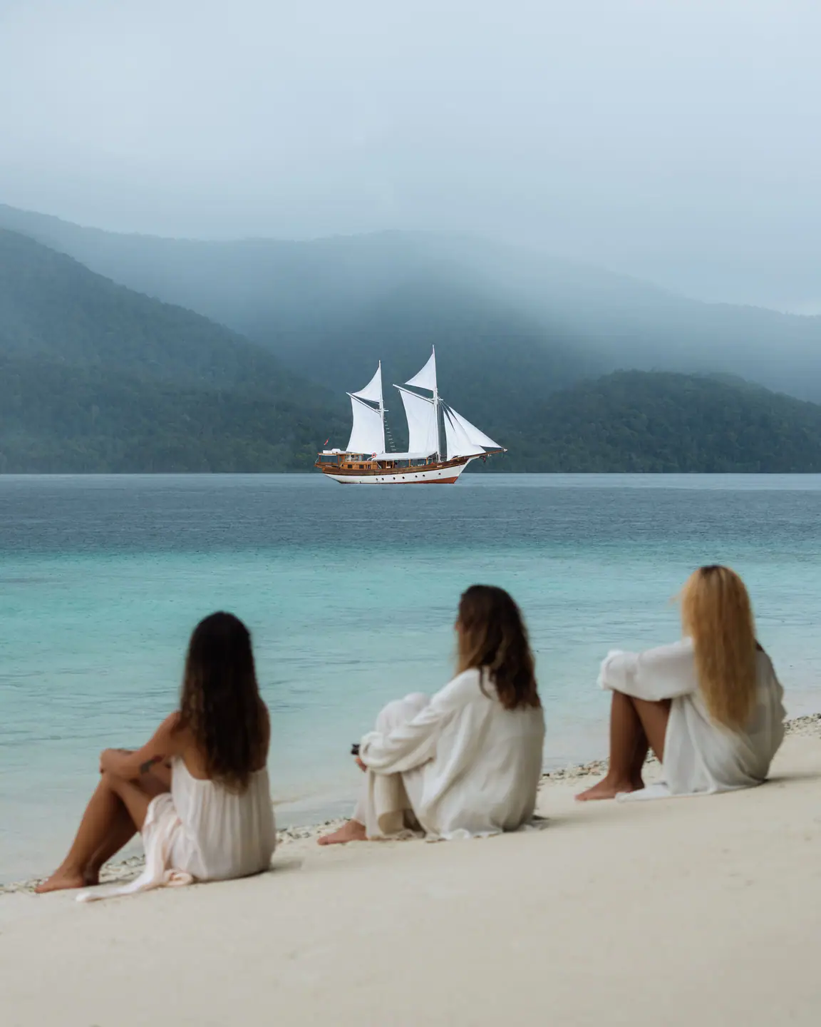 Beach view with phinisi yacht anchored