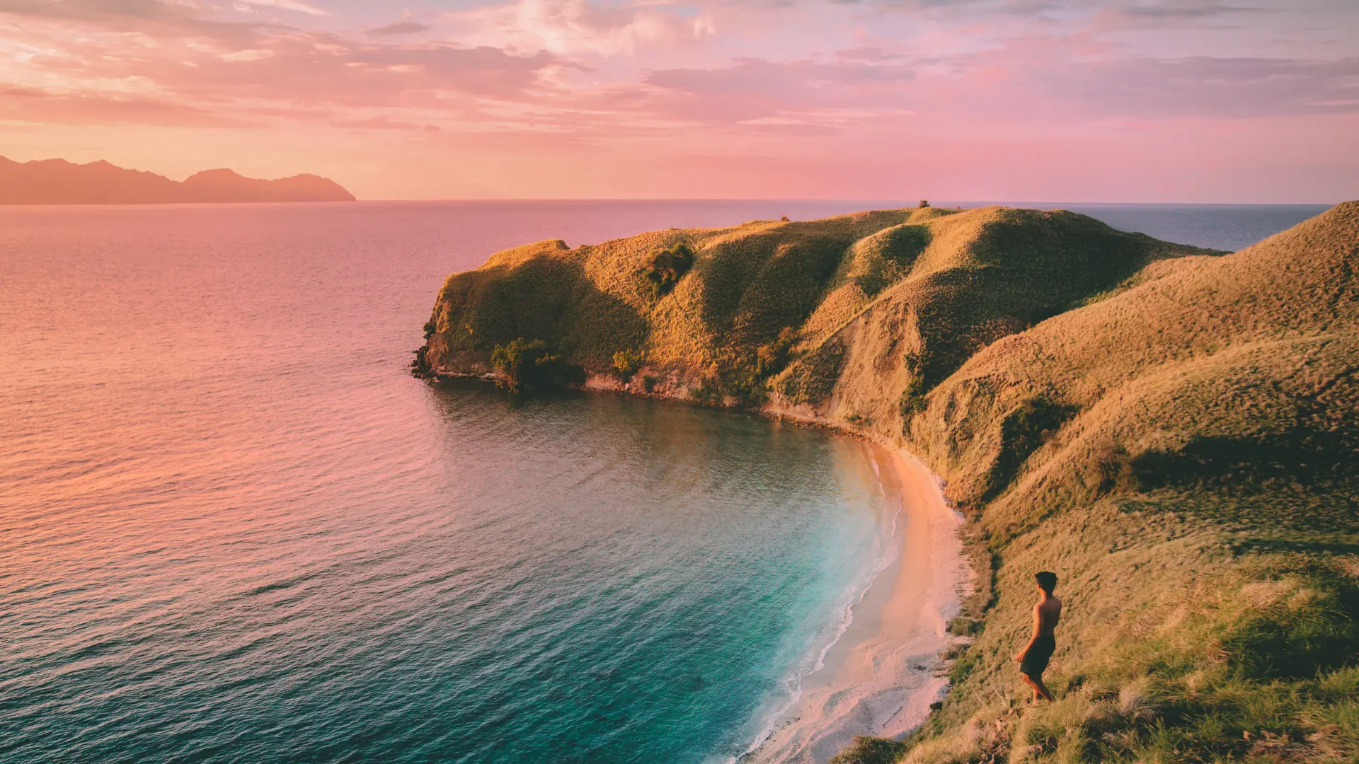 Komodo Island hidden bay sunset aerial view luxury yacht charter Indonesia