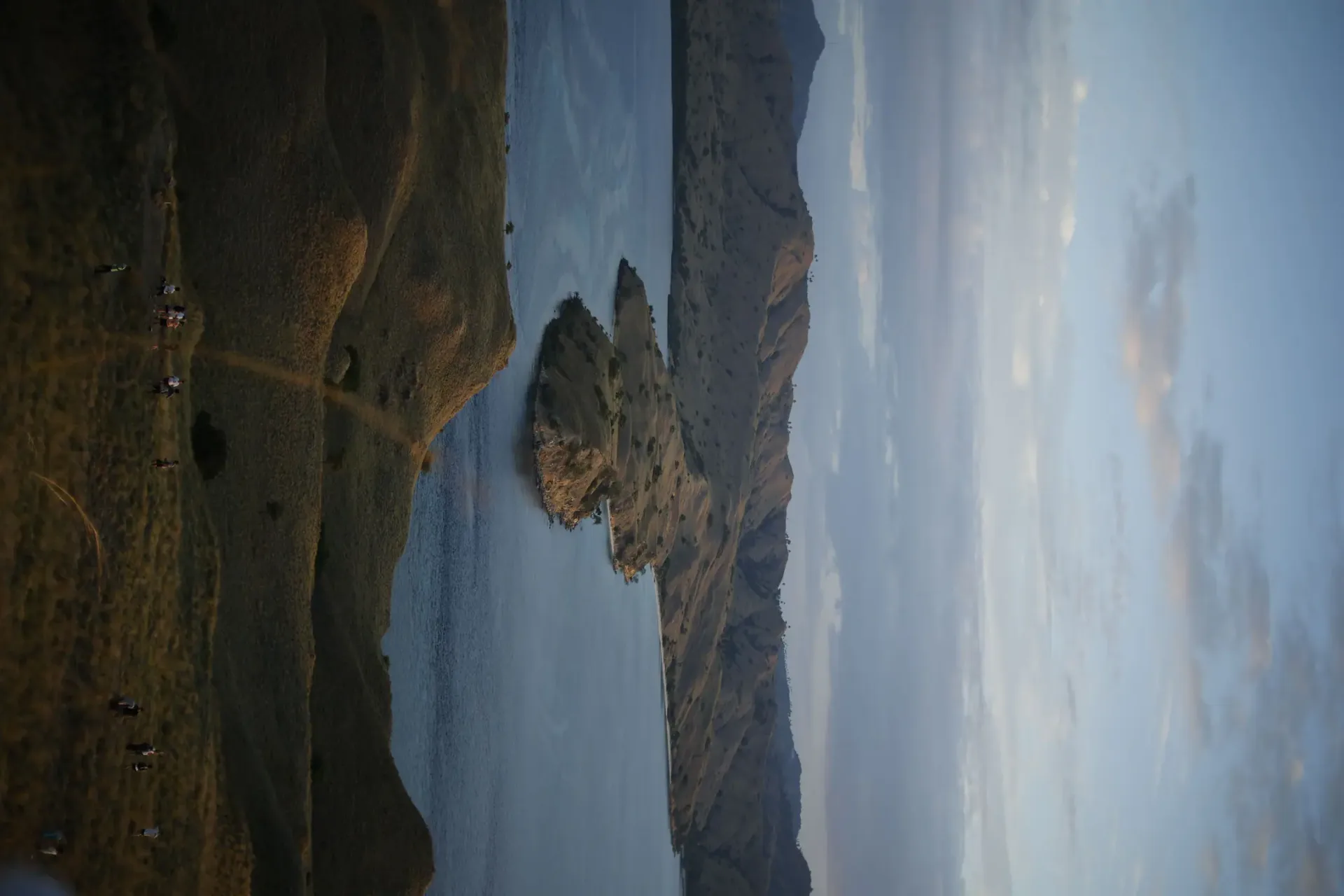 Padar Island sunrise hike dramatic coastline Komodo National Park trekking