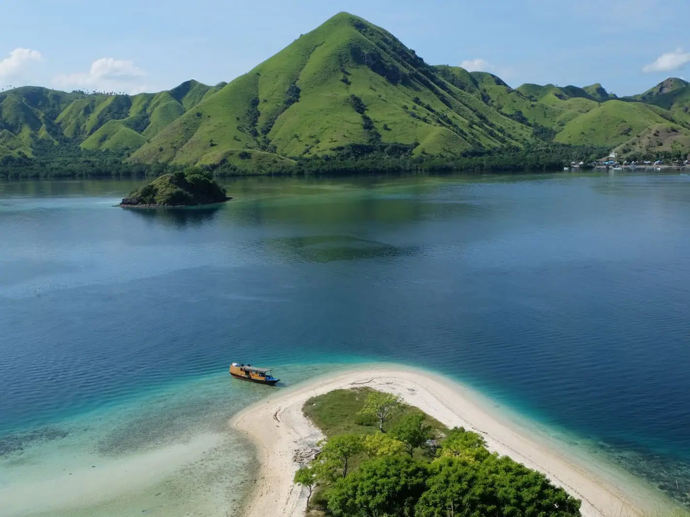 Aerial sandbar island with boat turquoise water Komodo National Park