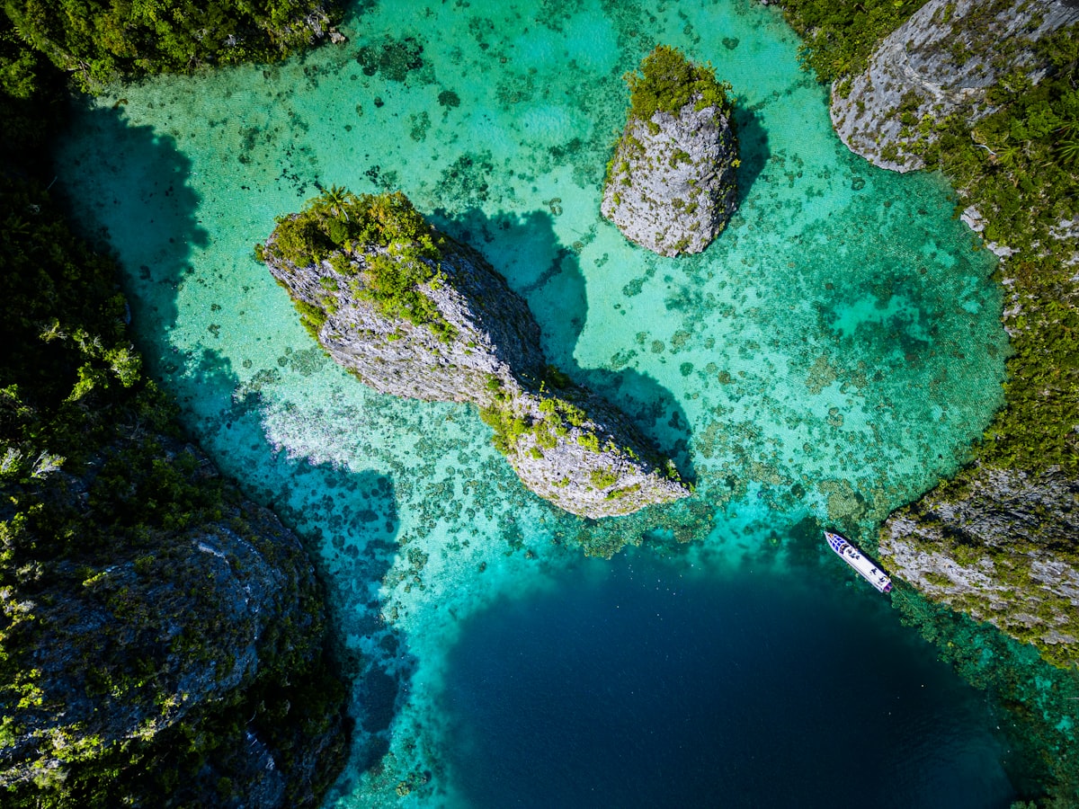 Turquoise lagoon surrounded by karst rocks Misool Raja Ampat