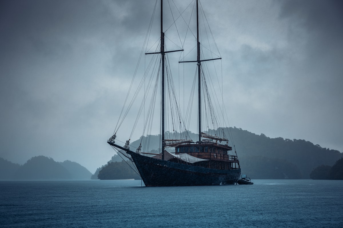 Yacht anchored near karst islands Misool Raja Ampat Indonesia