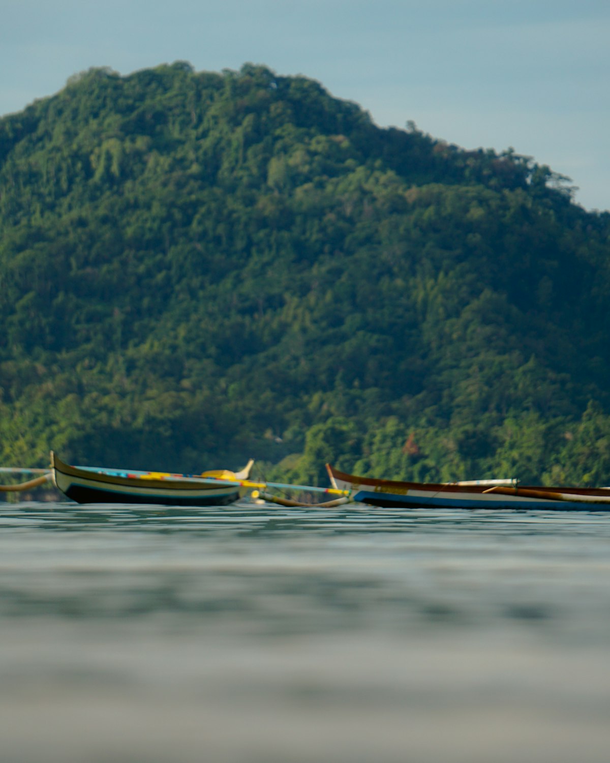 Boat on calm sea Maluku archipelago Spice Islands Indonesia